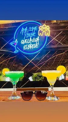 two margaritas and two glasses on a table at Hotel y Termales Castillo Del Lago Guatape in Horizonte