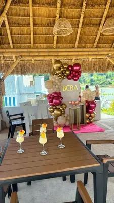 a table with wine glasses on top of it at Hotel y Termales Castillo Del Lago Guatape in Horizonte