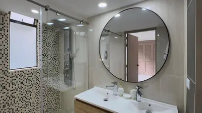 a bathroom with a sink and a mirror and a shower at 4BR 240 m² Fully Refurbished El Tesoro in Medellín