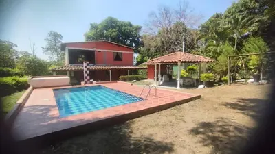 a house with a swimming pool in the yard at Finca Villa Dudia in Sopetran