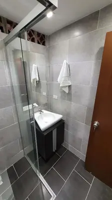 a bathroom with a sink and a shower at El Amañadero Paisa in Envigado