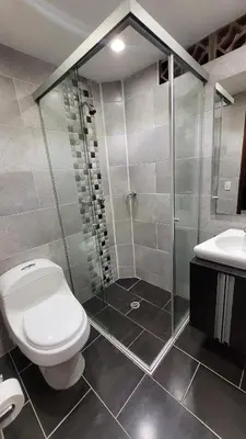 a bathroom with a shower and a toilet and a sink at El Amañadero Paisa in Envigado