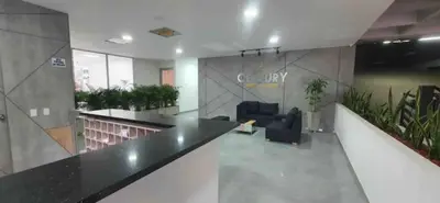 a lobby with a counter and chairs and plants at Piso27 PROMO! LUJOSO APARTAMENTO, PARKING Y ZONAS HUMEDAS in Sabaneta