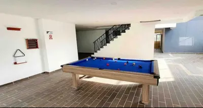 a pool table in a room with a staircase at Piso27 PROMO! LUJOSO APARTAMENTO, PARKING Y ZONAS HUMEDAS in Sabaneta