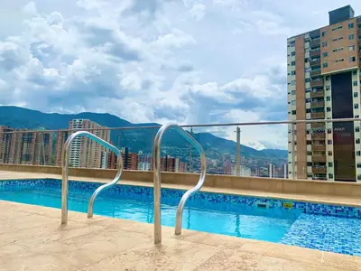 a view of a swimming pool on a building at Piso27 PROMO! LUJOSO APARTAMENTO, PARKING Y ZONAS HUMEDAS in Sabaneta