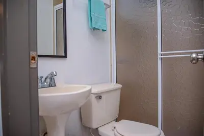 a bathroom with a sink and a toilet and a shower at Apartment Carrera 301 in Medellín