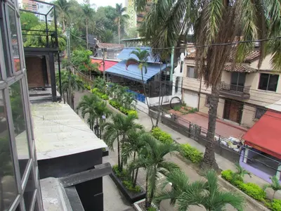 an overhead view of a city street with palm trees at Apartment Carrera 301 in Medellín