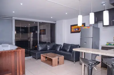 a living room with a couch and a table at Apartment Carrera 301 in Medellín