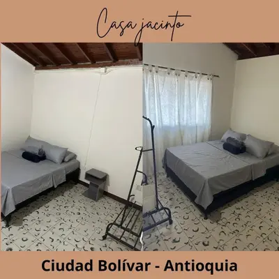 a room with two beds and a ladder in it at Casa Jacinto in Ciudad Bolívar