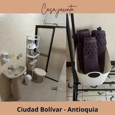 a bathroom with a toilet and a sink and a toilet at Casa Jacinto in Ciudad Bolívar
