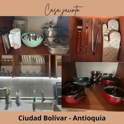 a kitchen counter with pots and pans and a sink at Casa Jacinto in Ciudad Bolívar