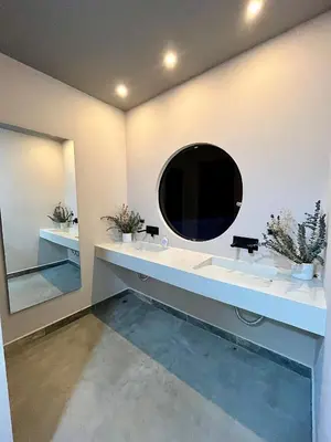 a bathroom with two sinks and a mirror at Finca Luxury en Doradal Antioquia in Puerto Triunfo