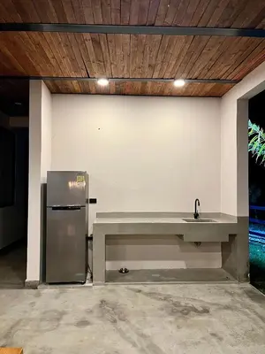 a kitchen with a sink and a refrigerator at Finca Luxury en Doradal Antioquia in Puerto Triunfo