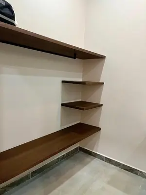 a room with wooden shelves on the wall at Finca Luxury en Doradal Antioquia in Puerto Triunfo