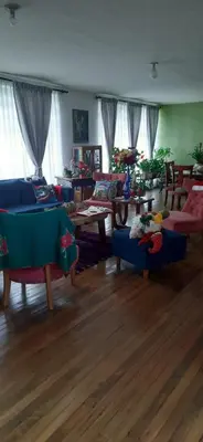 a living room with couches and tables in a room at Casa para ferias manizales in Manizales