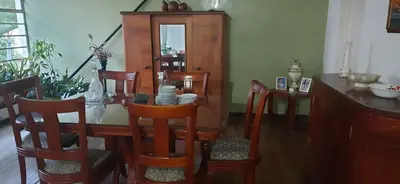 a dining room with a wooden table and chairs at Casa para ferias manizales in Manizales
