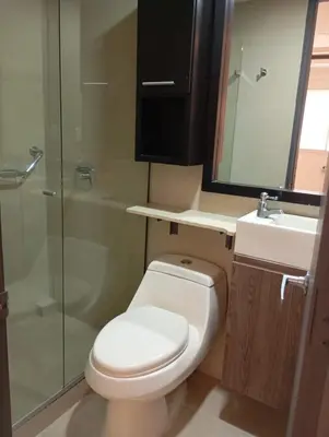 a bathroom with a toilet and a sink and a shower at Hotel Med 33 in Medellín