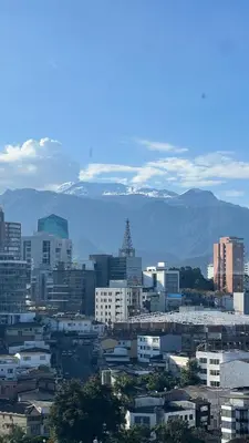 a city with buildings and mountains in the background at Apartamento Vista Panoramica 3 habitaciones 2 baños - Av Santander Sector El Cable y Estadio Palogrande in Manizales