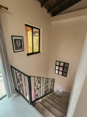 a staircase in a house with a window at Paco House in Jardin