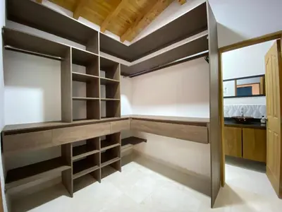 a room with wooden shelves and a closet at Fraternity Room, Habitación Deluxe - solo a una cuadra del parque in Carmen de Viboral
