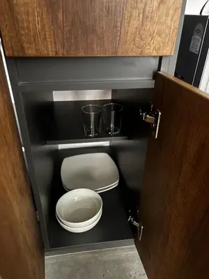 a toilet in a cabinet with two buckets on it at Encantador Loft urbano en el corazón de Medellín in Medellín