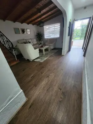 a living room with a couch and a table at Finca en el corazón de llanogrande in Rionegro