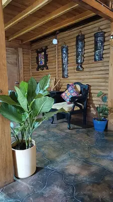 a living room with a bench and a chair at Finca la carolina in Medellín