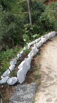 a row of rocks on the side of a road at Finca la carolina in Medellín