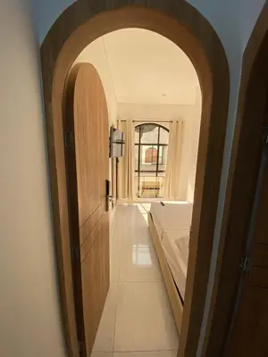 an arched hallway with a bed in a room at Habitaciones en Doradal 205 in Doradal