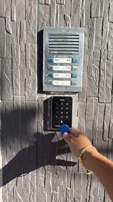 a person holding a blue object in front of an electronic device at Nuevo cerca poblado 301 in Medellín