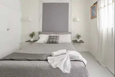 a bedroom with a large bed with towels on it at El Poblado 4 Bedroom 3 Bathroom private Terrace in Medellín