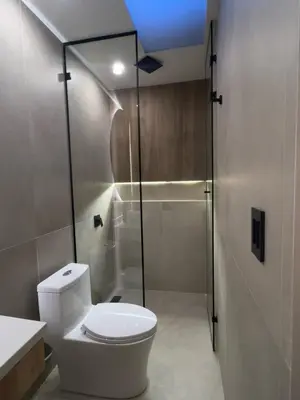 a bathroom with a toilet and a shower at Hotel Time Oclock in Medellín
