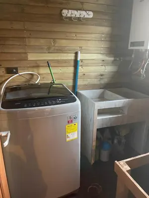 a kitchen with a sink and a dish washer at Rancho Forest Guatape in Guatapé