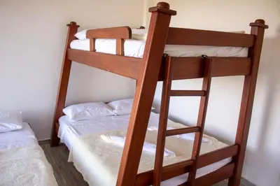 a couple of bunk beds in a room at Hotel Curazao Natural Living in Cocorná