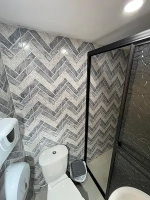 a bathroom with a toilet and a shower at Hotel Curazao Natural Living in Cocorná