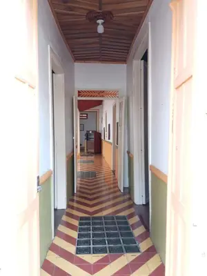a hallway of a building with a tile floor at Casa Hotel Santa Laura Jericó in Jericó
