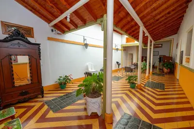 a large room with a lobby with plants in it at Casa Hotel Santa Laura Jericó in Jericó