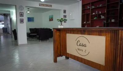a sign that says casa when i on a counter at Casa MoraZ in Medellín