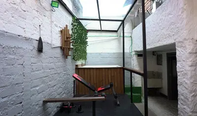 a chair sitting on a balcony in a building at Casa MoraZ in Medellín