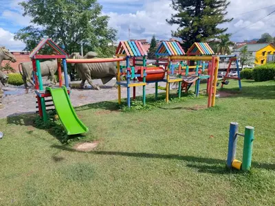 a group of colorful playground equipment in a park at San Antonio in El Peñol