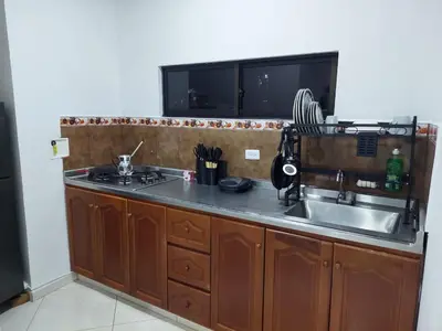 a kitchen with a sink and a counter top at San Antonio in El Peñol