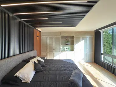 a bedroom with a large bed and a large window at 4BR 240 m² Pool Next to El Tesoro Mall in Medellín