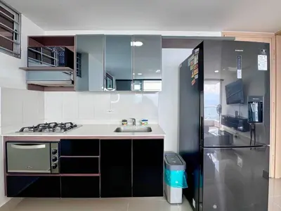a kitchen with a sink and a refrigerator at 3BR Panoramic Near Country Club El Poblado in Medellín
