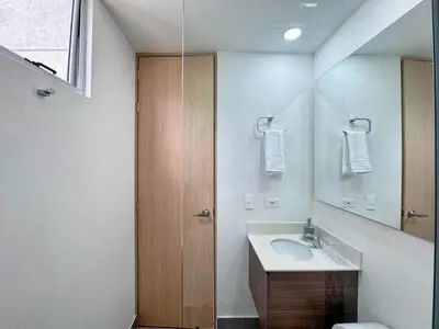 a bathroom with a sink and a mirror at 3BR Panoramic Near Country Club El Poblado in Medellín