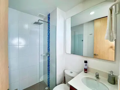 a bathroom with a shower and a toilet and a sink at 3BR Panoramic Near Country Club El Poblado in Medellín