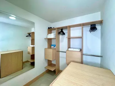 a room with a table and some shelves and a mirror at 3BR Panoramic Near Country Club El Poblado in Medellín