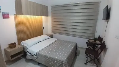 a small bedroom with a bed and a window at Apartamento Aeropuerto Rionegro in Rionegro