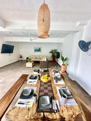 a table with fruits on it in a living room at Villa Paulina in Honda