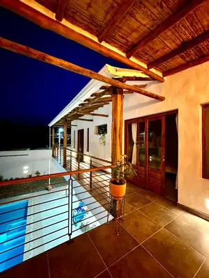 a balcony of a house with a swimming pool at Villa Paulina in Honda
