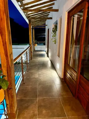 a walkway leading to the balcony of a house at Villa Paulina in Honda